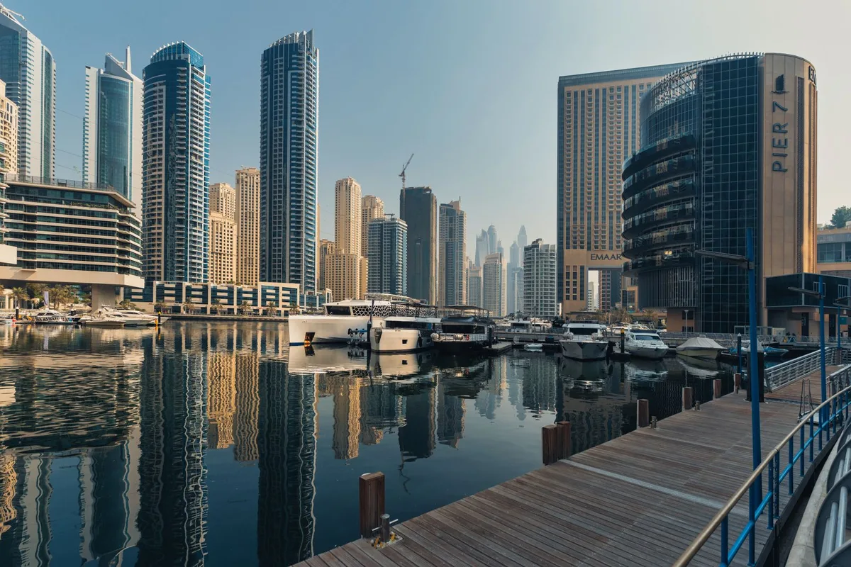 Dubai Marina towers reflected in the marina water
