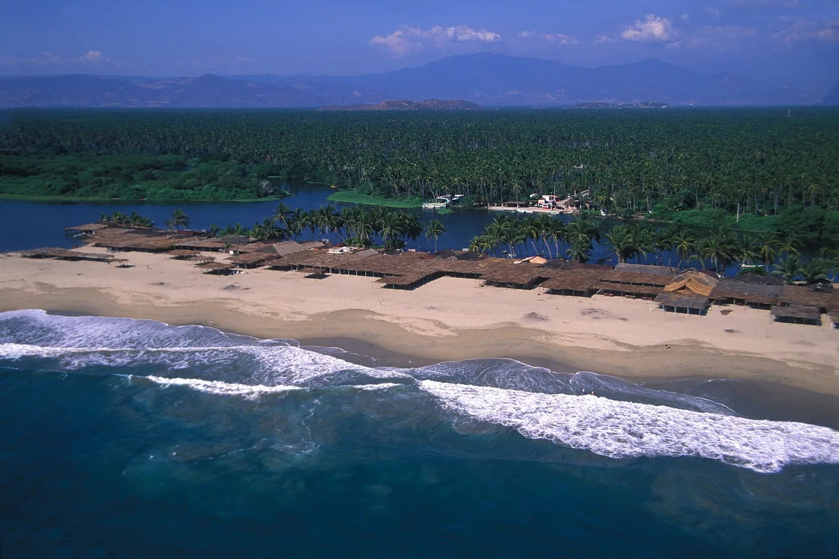 Barra de Coyuca beach and the palm groves of Coyuca Lagoon from the air