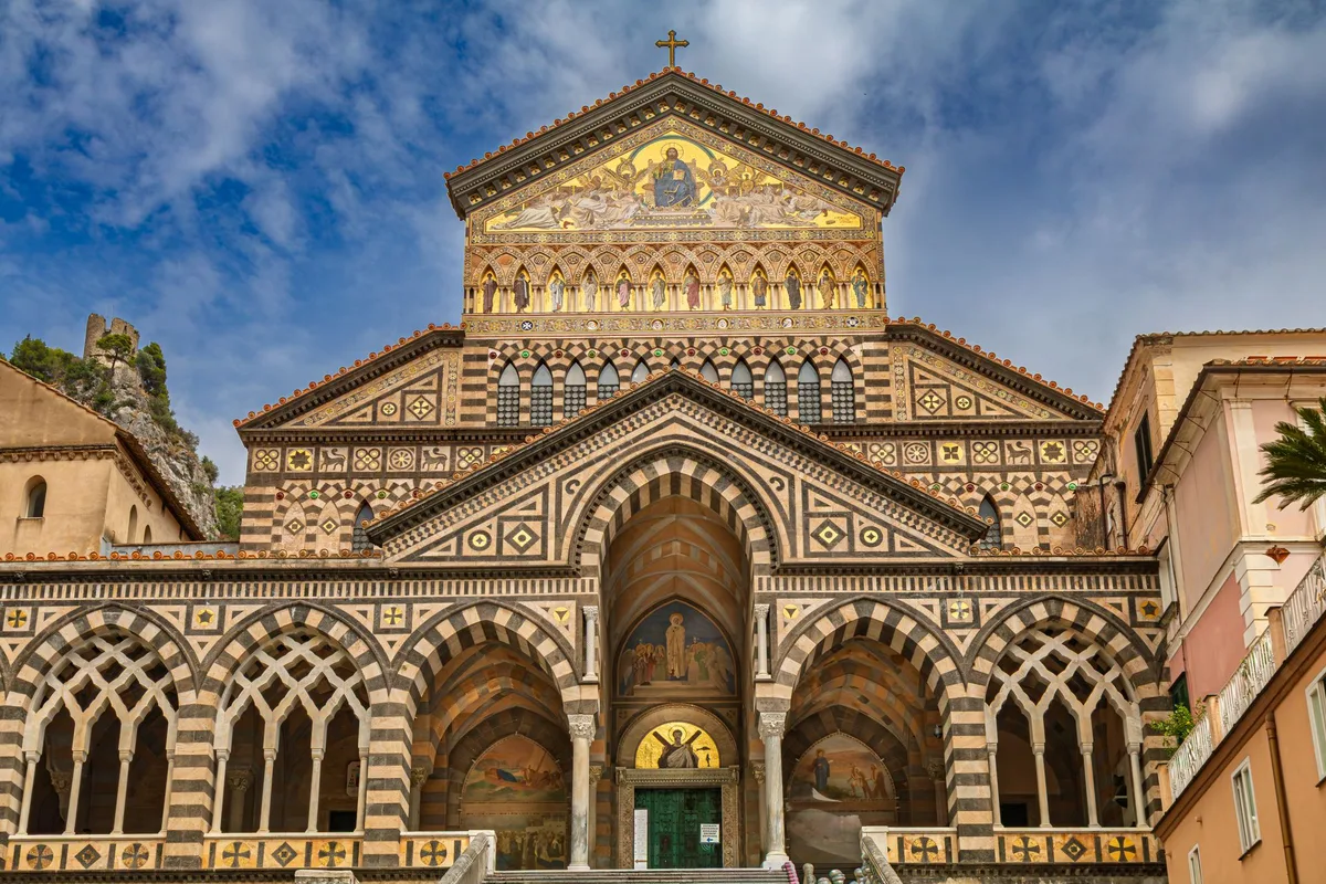 The striped facade and gold mosaic gable of Amalfi Cathedral