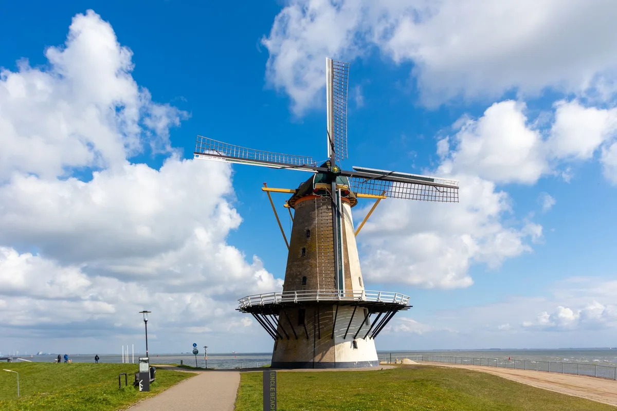 A Dutch windmill under a big sky