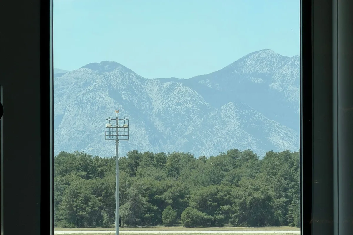 The Taurus mountains through the terminal window at Antalya Airport