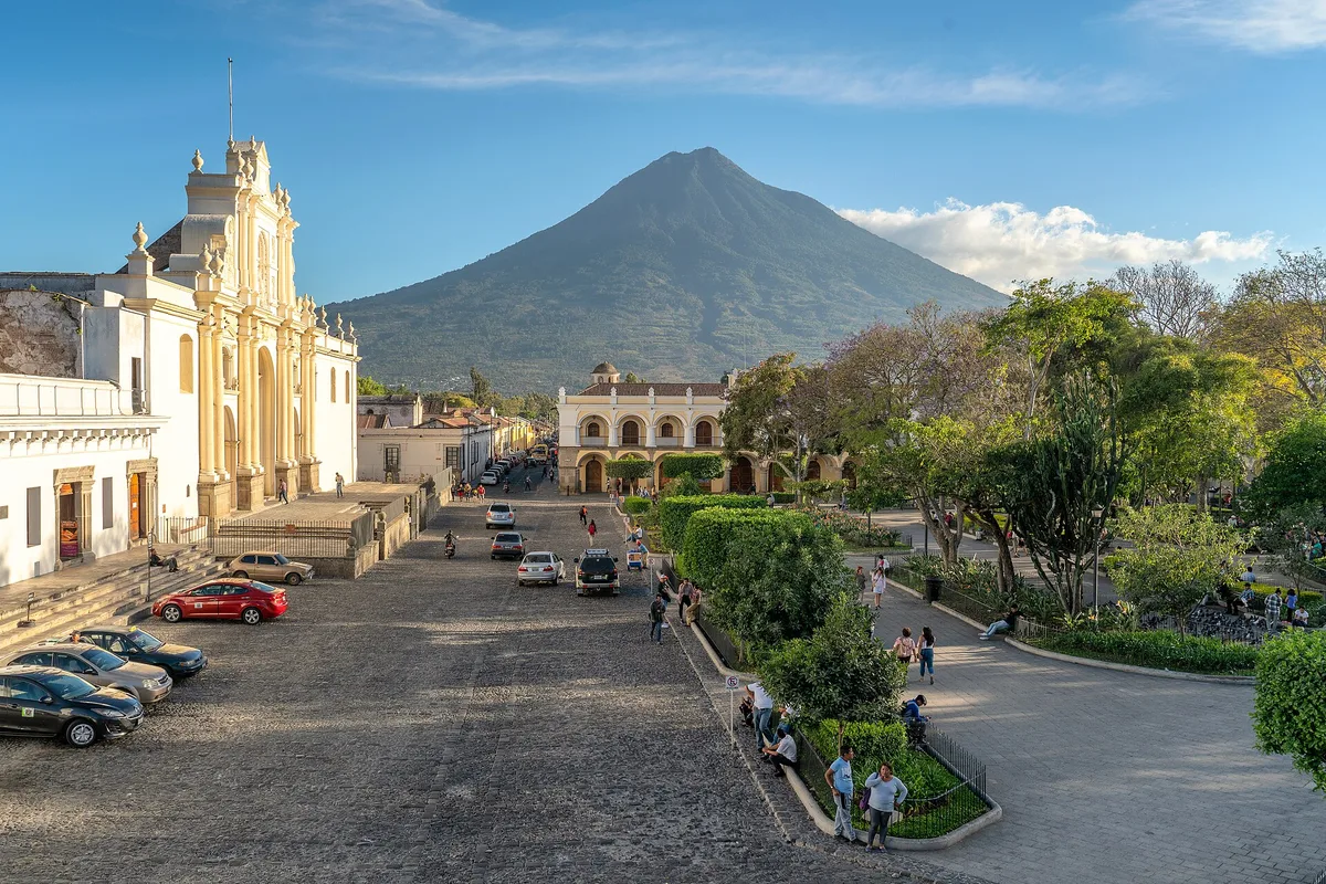 A cobbled street below La Merced church, climbing towards Volcán de Agua