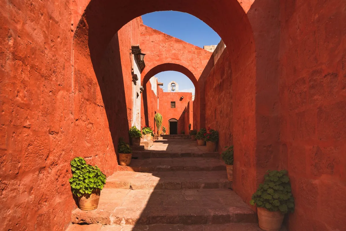 A red sillar lane inside the Santa Catalina Monastery in Arequipa