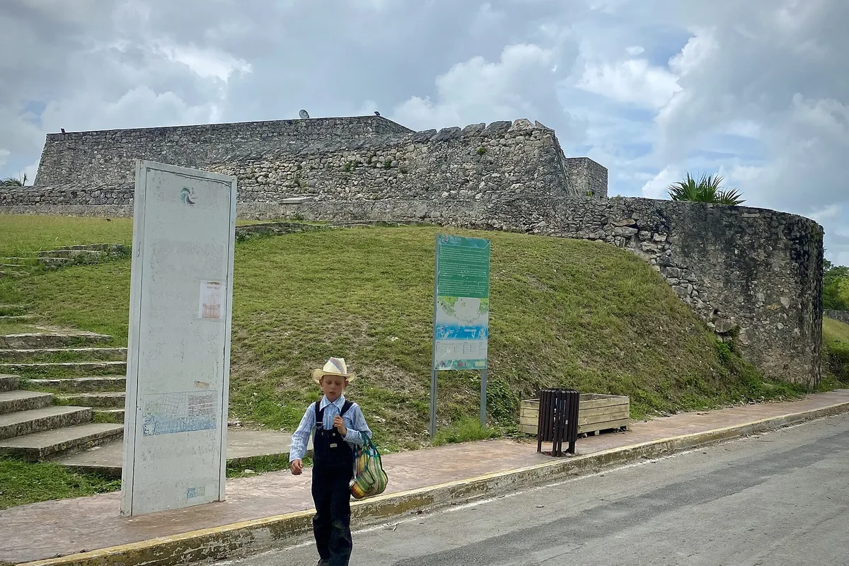 The stone walls of the San Felipe fort above the lagoon shore in Bacalar
