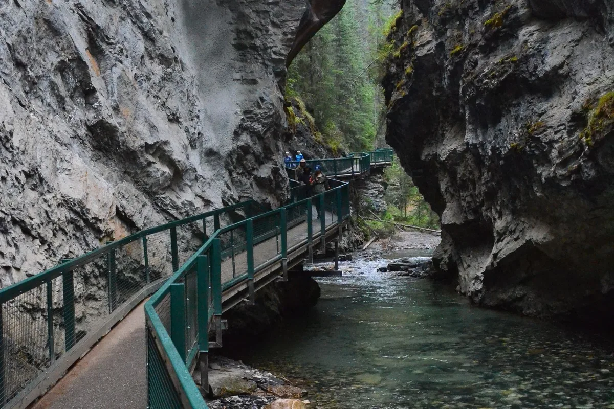 The catwalk clipped to the wall of Johnston Canyon above the creek
