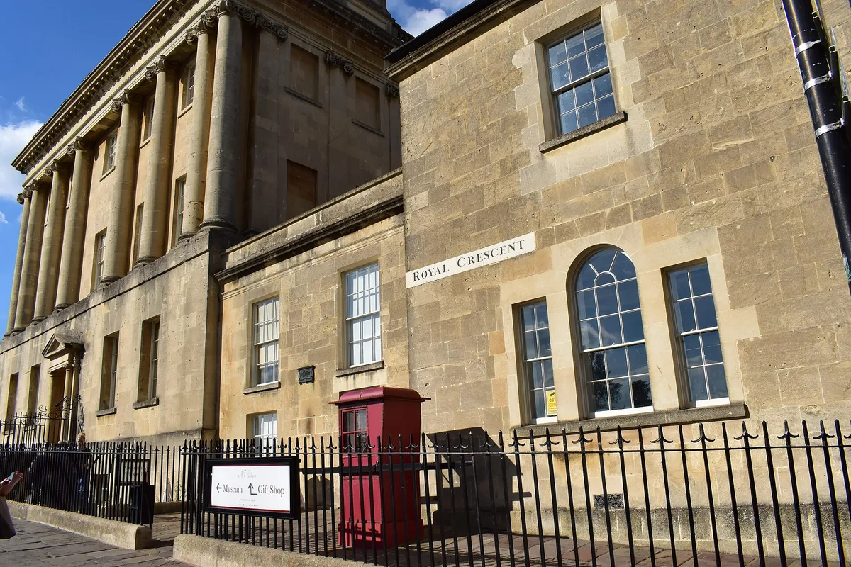 The eastern end of the Royal Crescent on a bright morning, a red post box in front