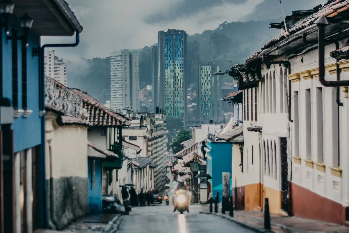 A La Candelaria street of colonial houses under the downtown towers