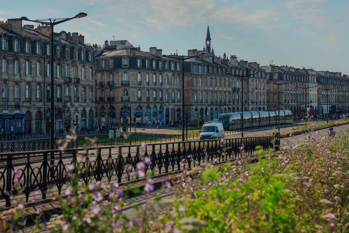 A tram on the Garonne quays, passing the 18th-century facades