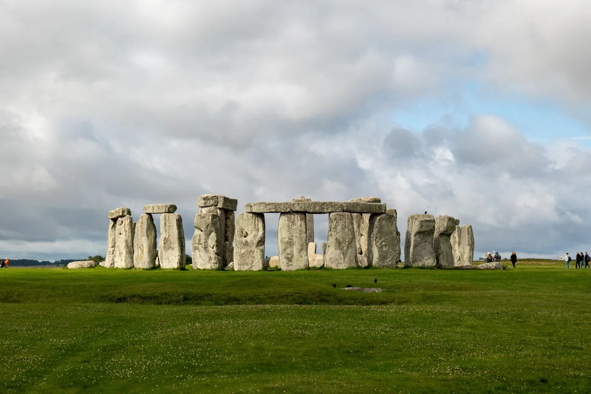 Stonehenge standing in open grassland under a big sky on Salisbury Plain