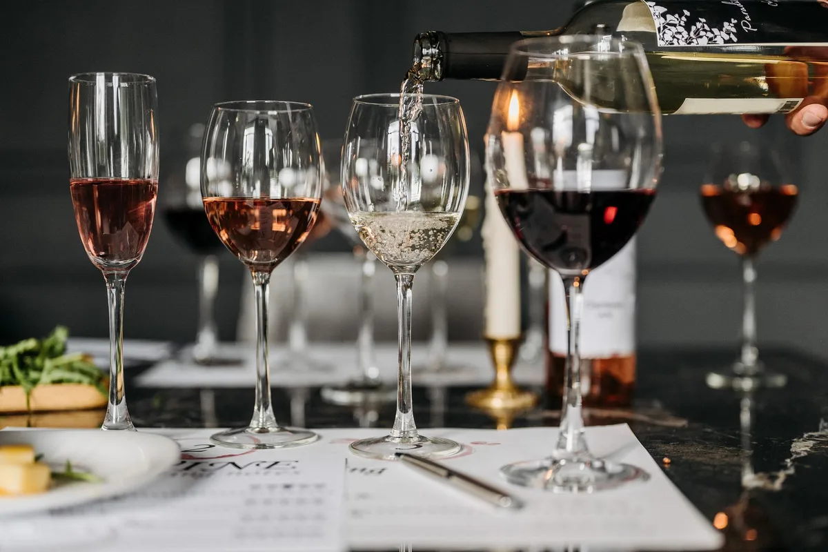 A tutored wine tasting in progress, glasses of Sussex wine lined up on the table