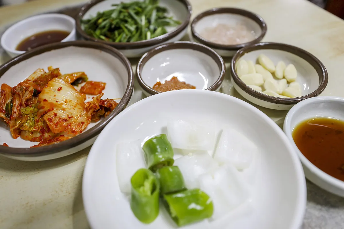 A bowl of dwaeji gukbap, Busan's pork soup, at Songjeong Samdae Gukbap in Seomyeon