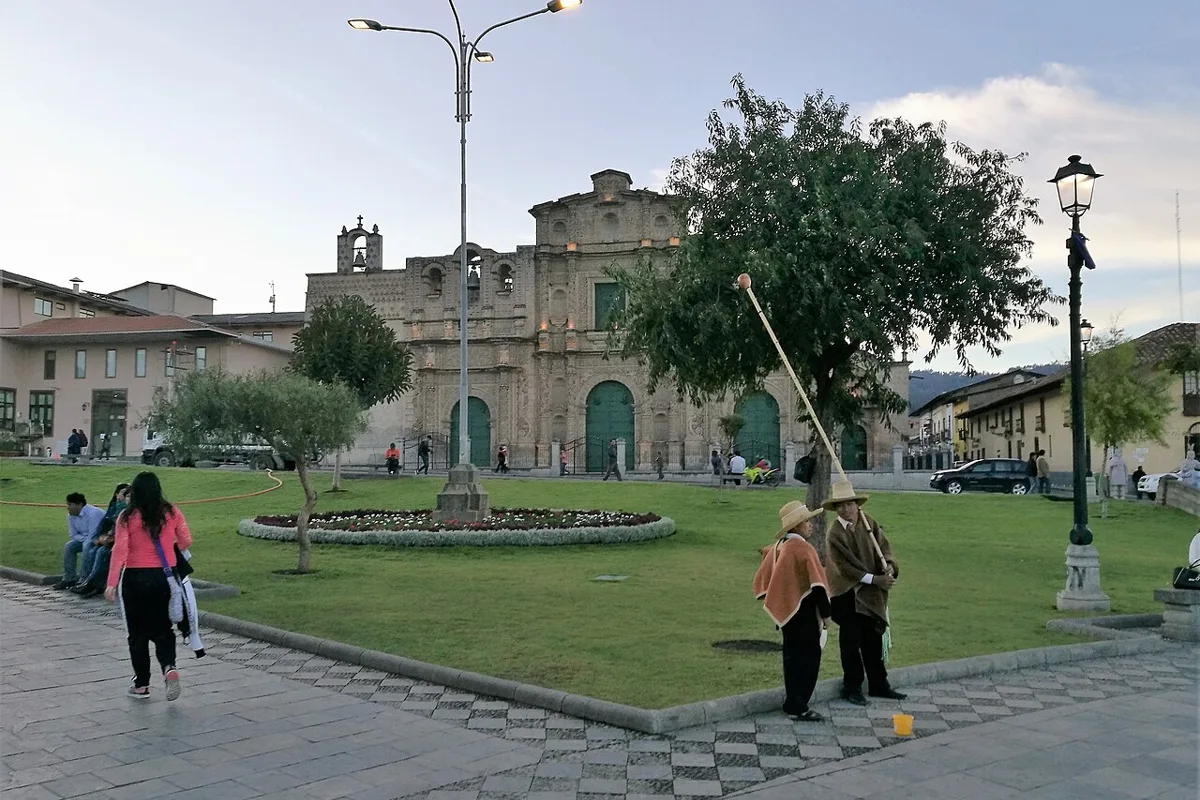 The Plaza de Armas in late afternoon, with the San Francisco church behind the lawns