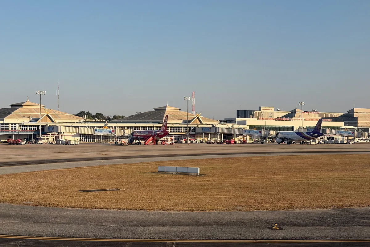 The Lanna-roofed terminal of Chiang Mai Airport seen across the apron