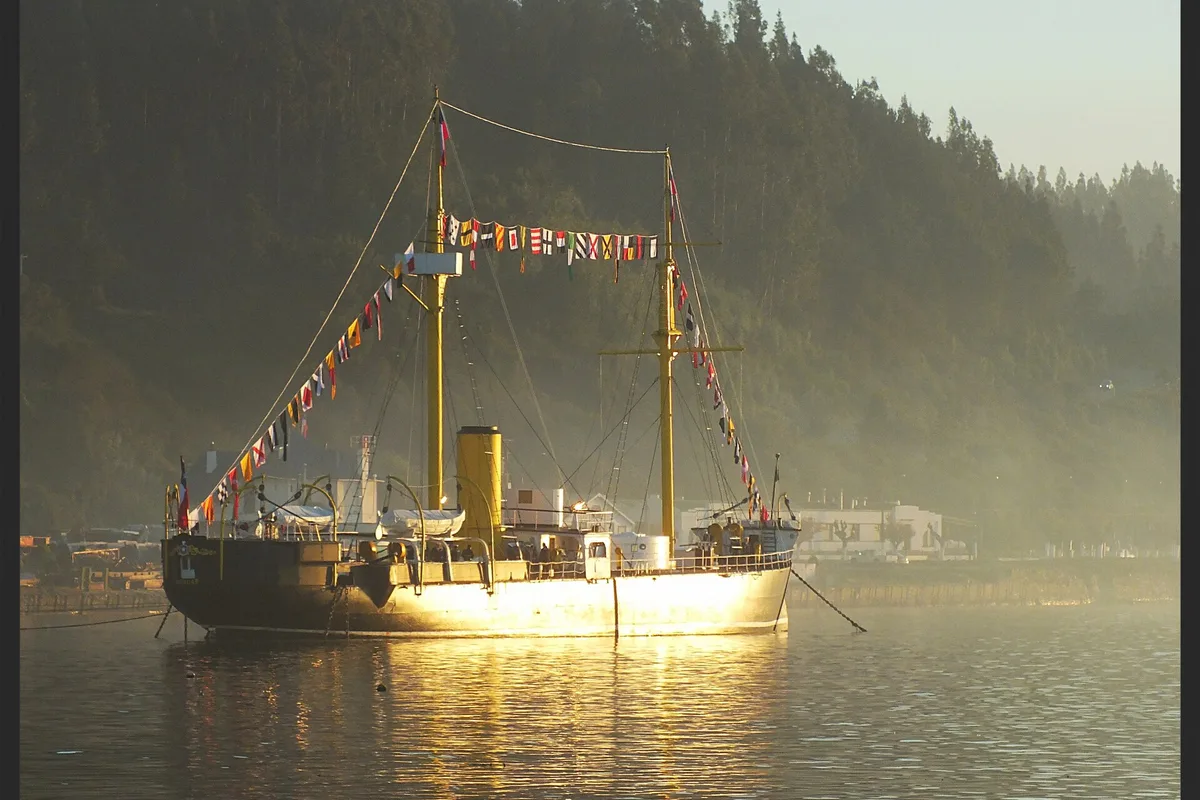The ironclad Monitor Huáscar dressed overall at anchor in Talcahuano