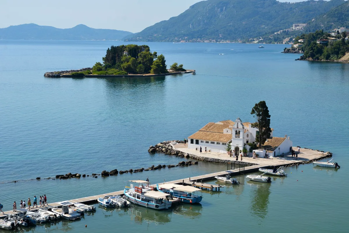 The Vlacherna Monastery on its causeway, with Pontikonisi, Mouse Island, behind