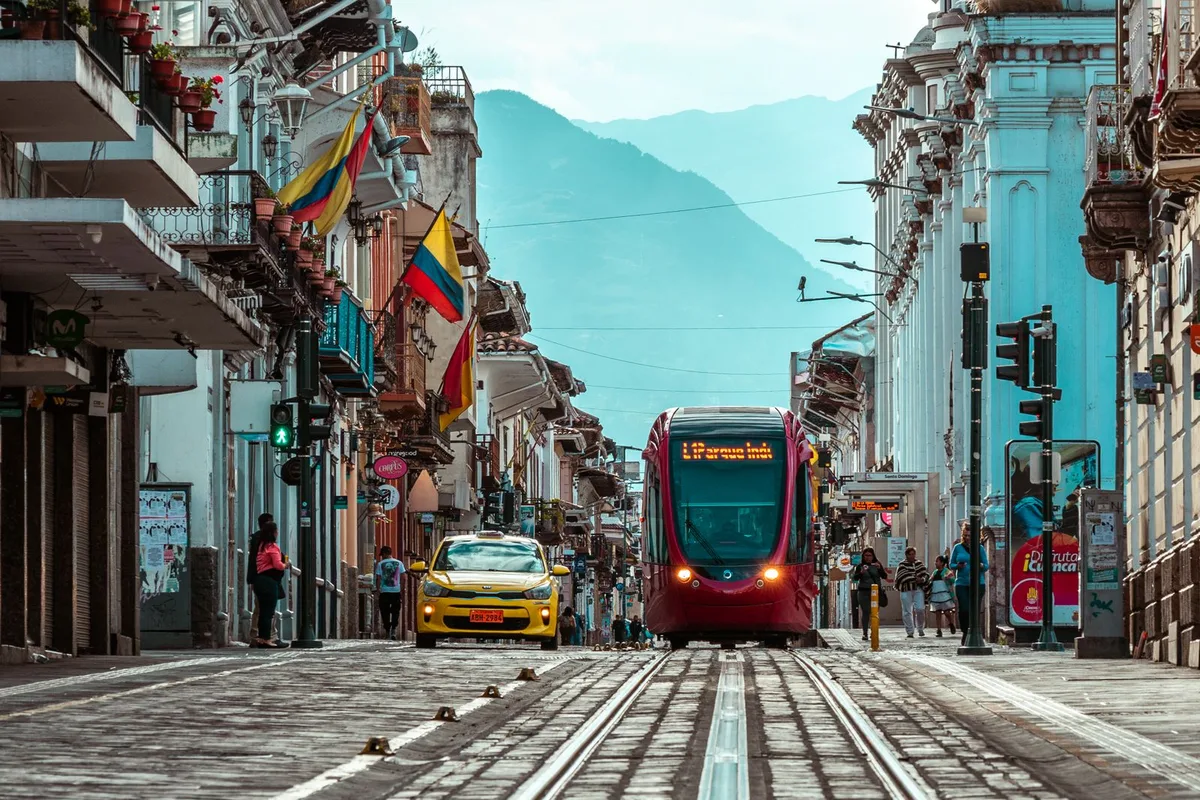 The red Tranvía tram running along Calle Gran Colombia in the historic centre
