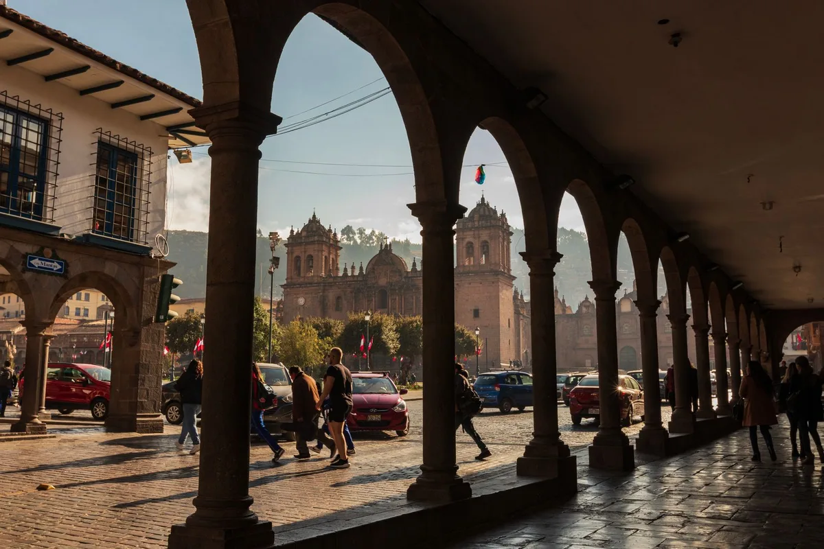 The Plaza de Armas portales with La Compañía church beyond, Cusco
