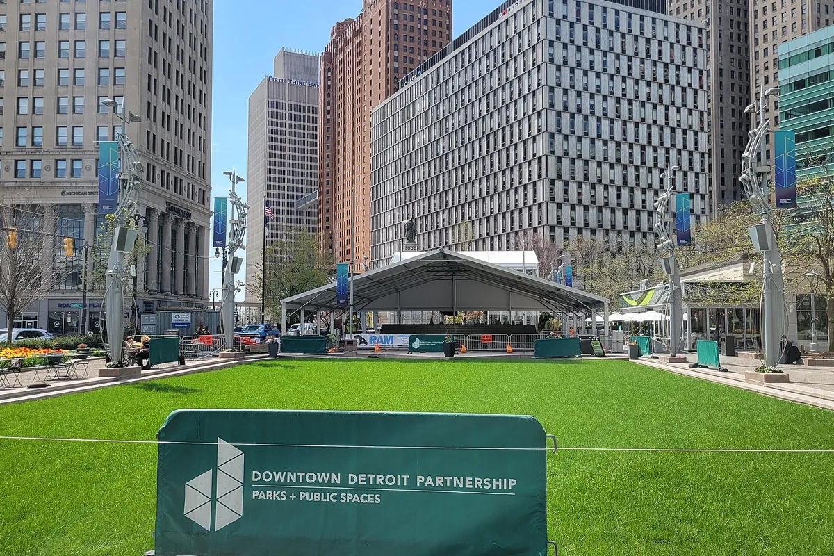 The lawn at Campus Martius Park, ringed by downtown towers