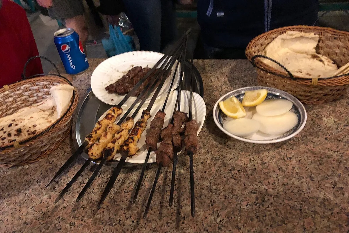 Grills, skewers and flatbread on a table in Doha