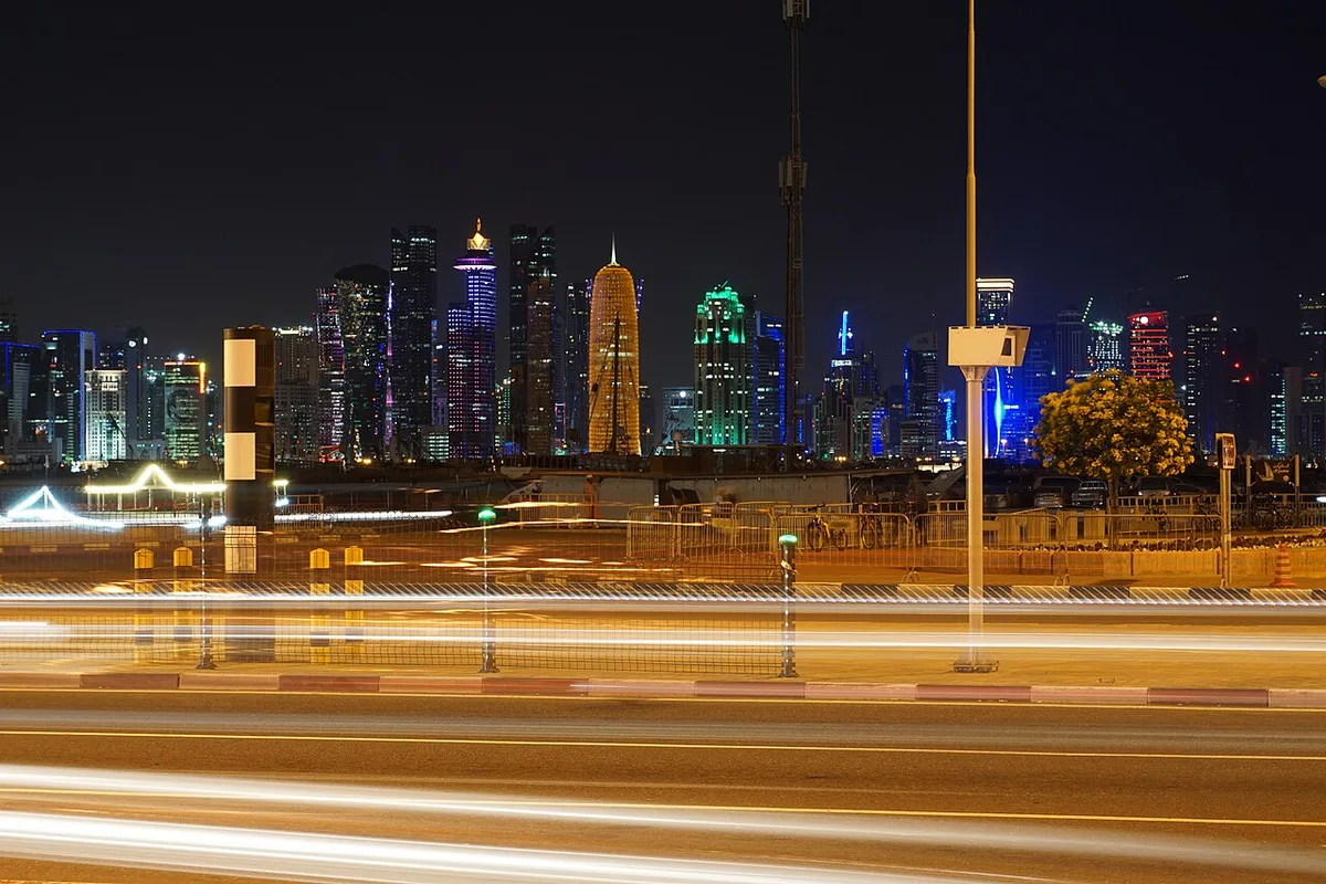 The Corniche road and West Bay skyline at night
