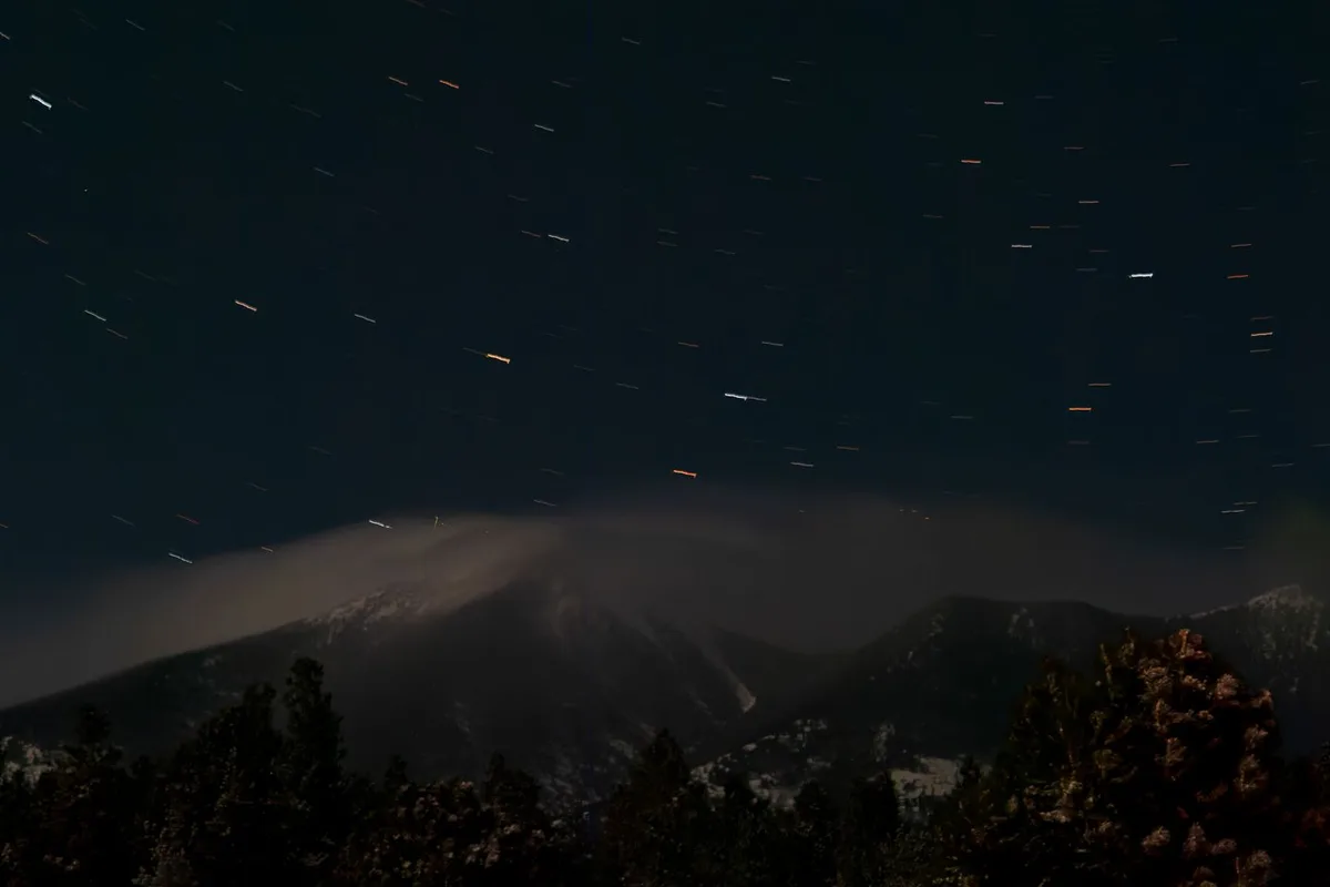 Star-filled night sky above the San Francisco Peaks in Flagstaff, Arizona