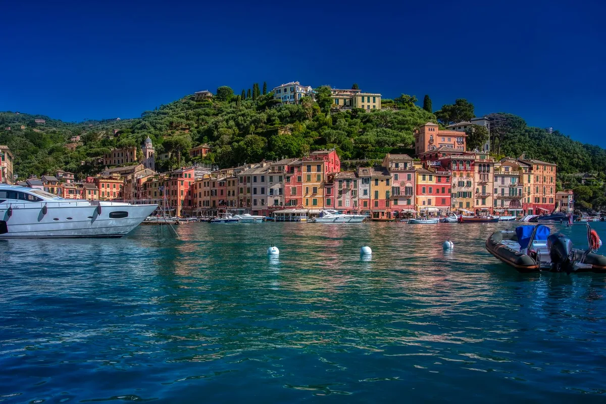 Portofino's harbour, yachts in front of the pastel houses of the Piazzetta
