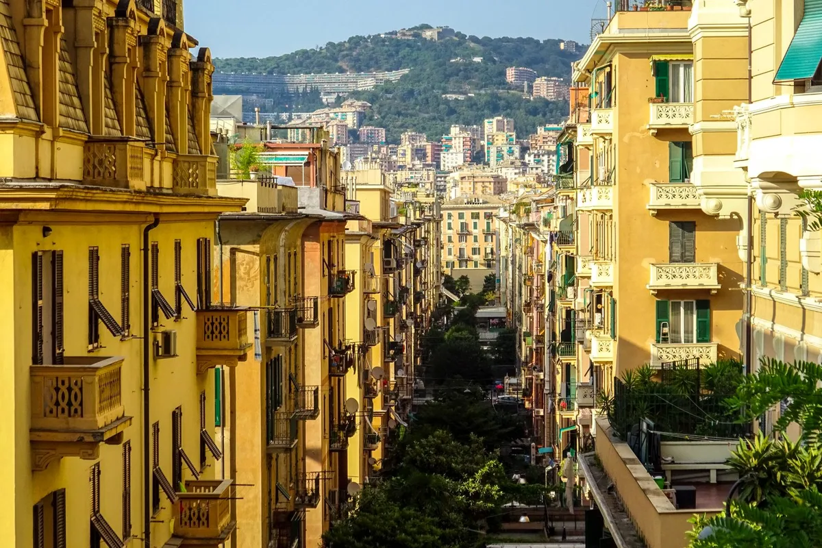 A Genoese street of tall painted palazzi