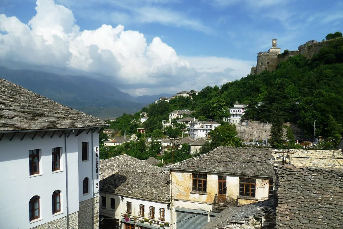 Gjirokaster old town climbing to its castle, slate roofs under the mountains