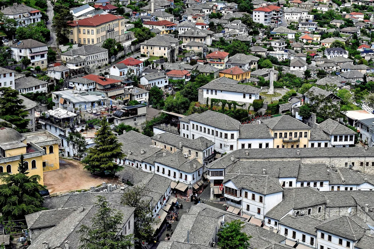 Slate rooftops of Gjirokaster old town seen from above, house by stone house