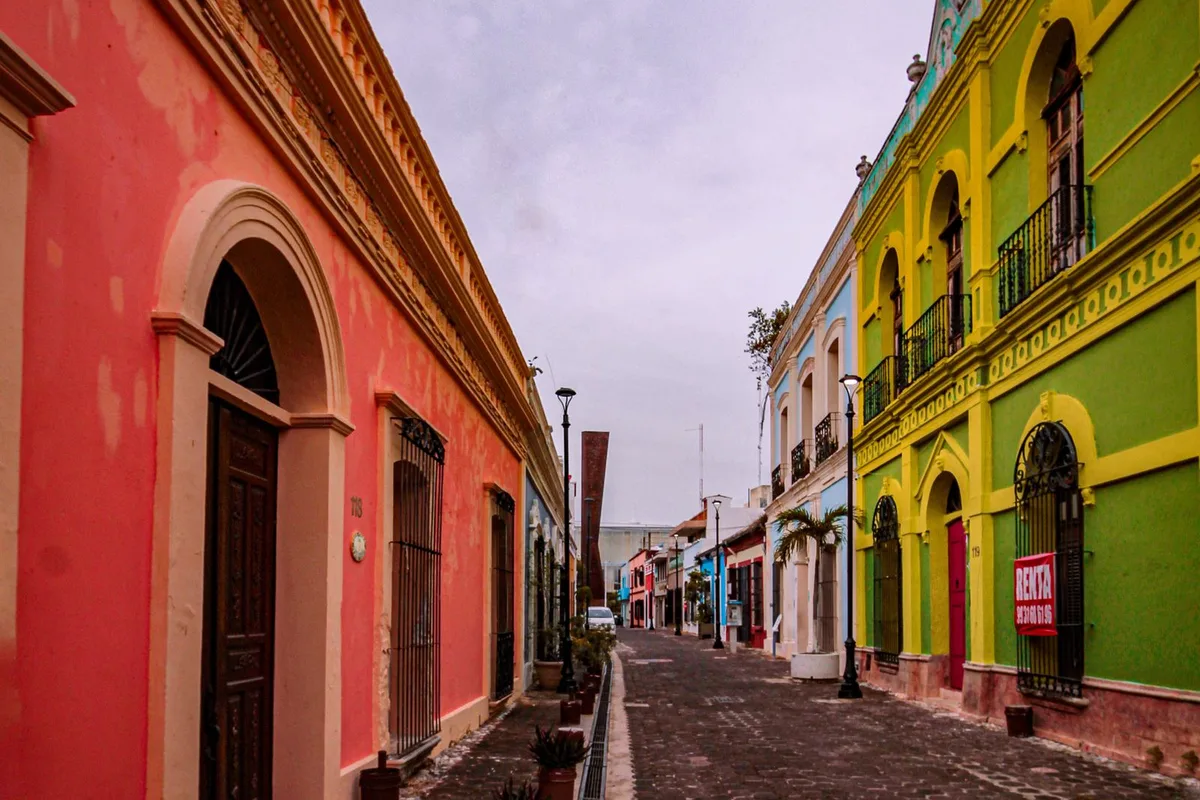 A cobblestone street of colorful colonial houses in Granada, Nicaragua