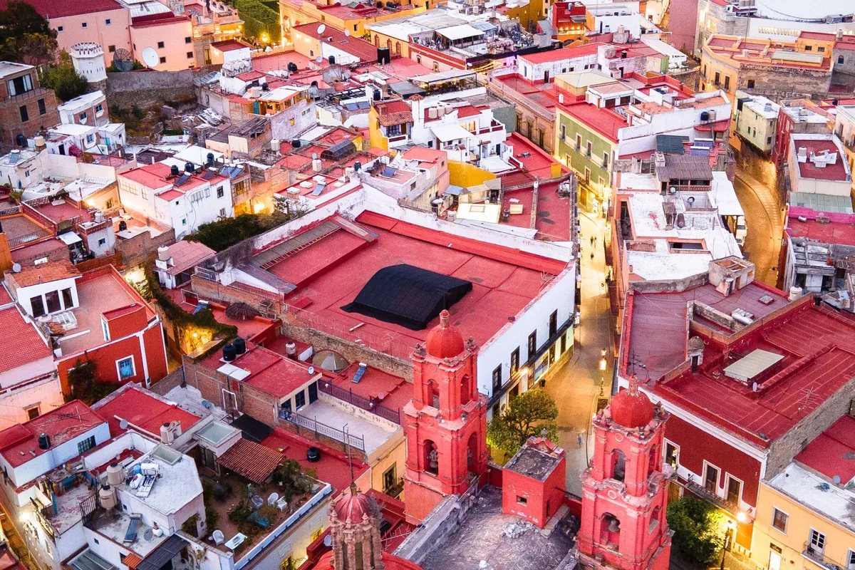 Guanajuato at dusk, the coloured houses and church domes of the Centro from above
