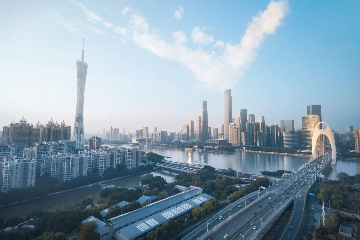 Aerial view of the Guangzhou skyline with the Canton Tower and the Pearl River at dusk