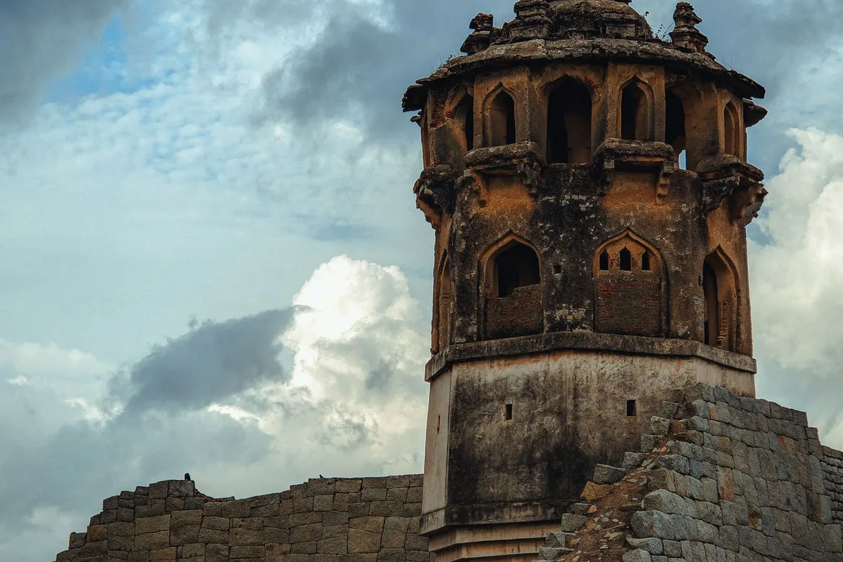 A watchtower of the Zenana Enclosure among the ruins of Hampi