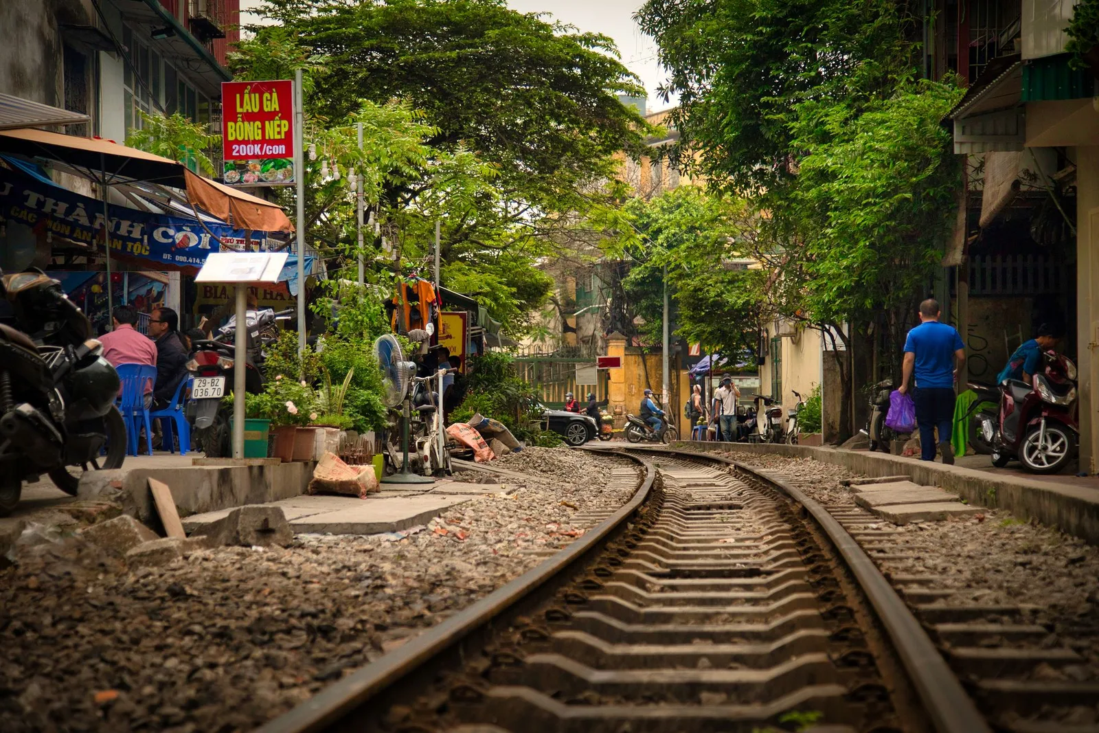 Hanoi's Train Street, tracks running between cafés and homes