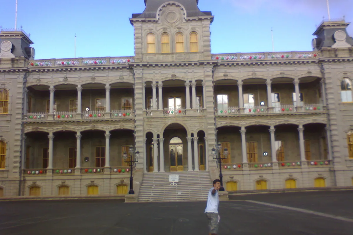 Iolani Palace framed by palm trees in downtown Honolulu