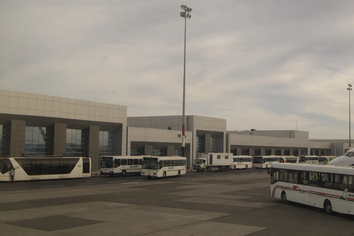 Hurghada International Airport terminal and the tour buses outside
