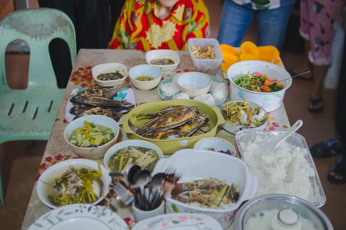 A table of Egyptian dishes and Red Sea fish at a Hurghada seafood meal