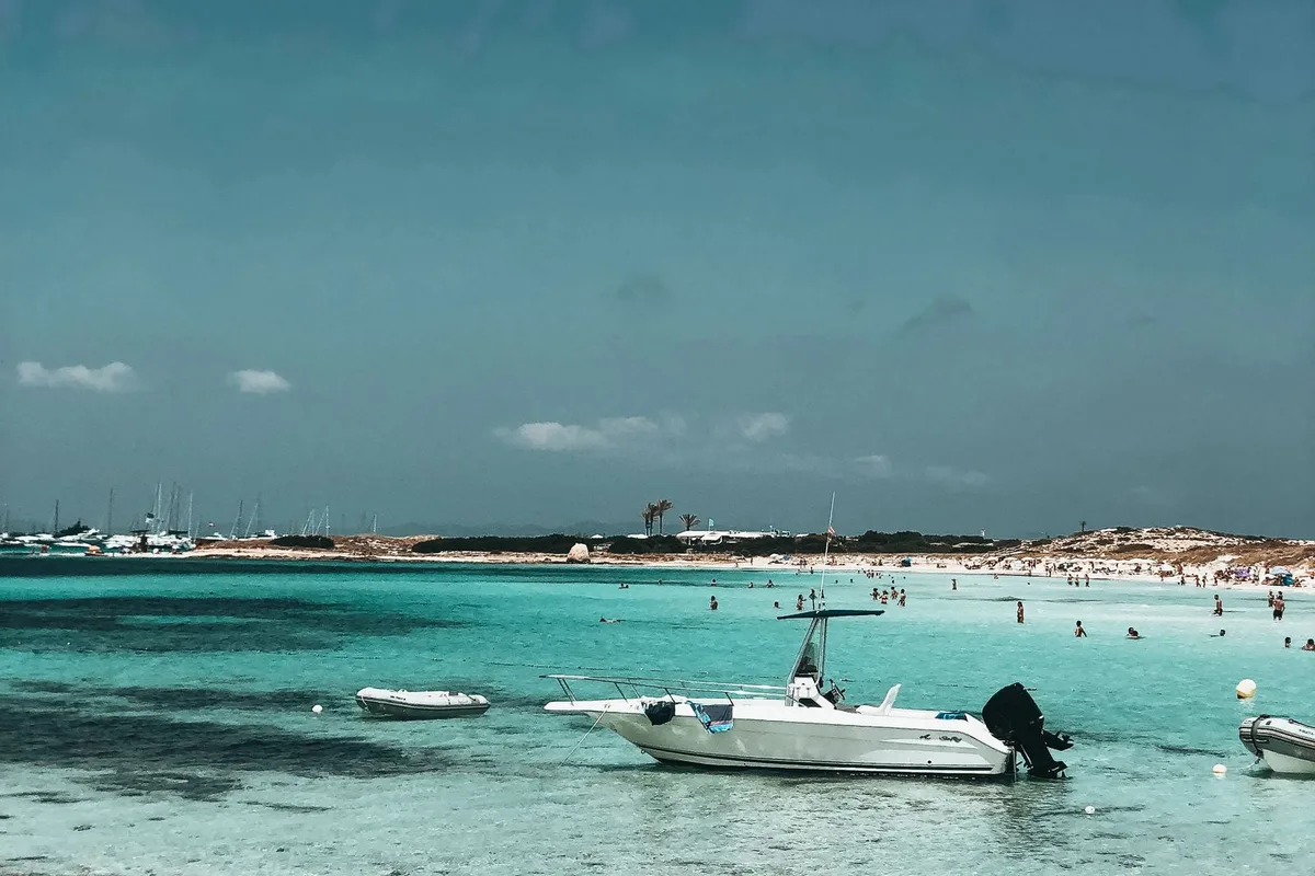 Boats anchored in the turquoise shallows off Formentera