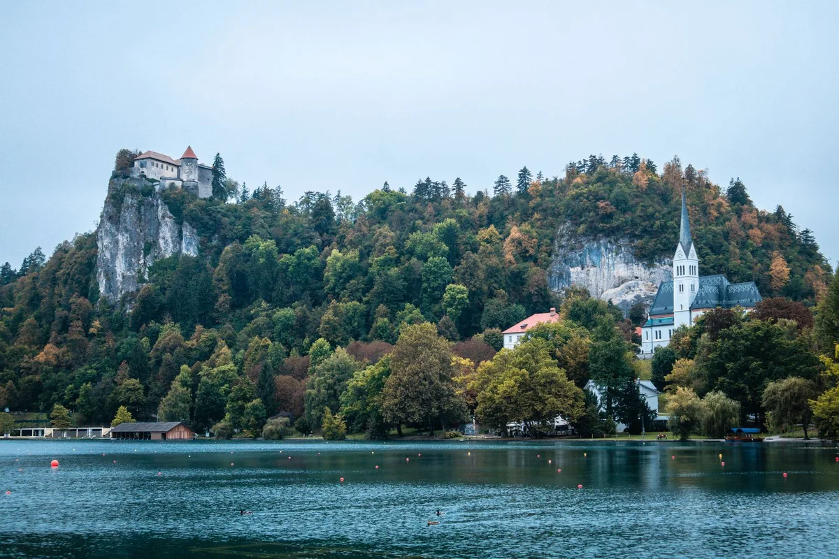 Bled Castle on its cliff above the lake, the parish church of St Martin below