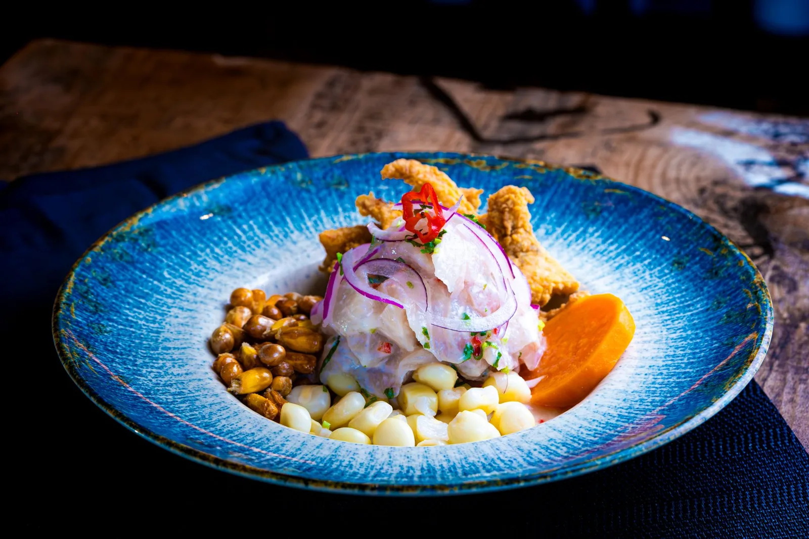 Ceviche and Nikkei dishes at a Lima restaurant table