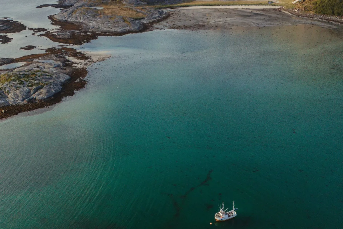 A boat on the fjord waters of Lofoten