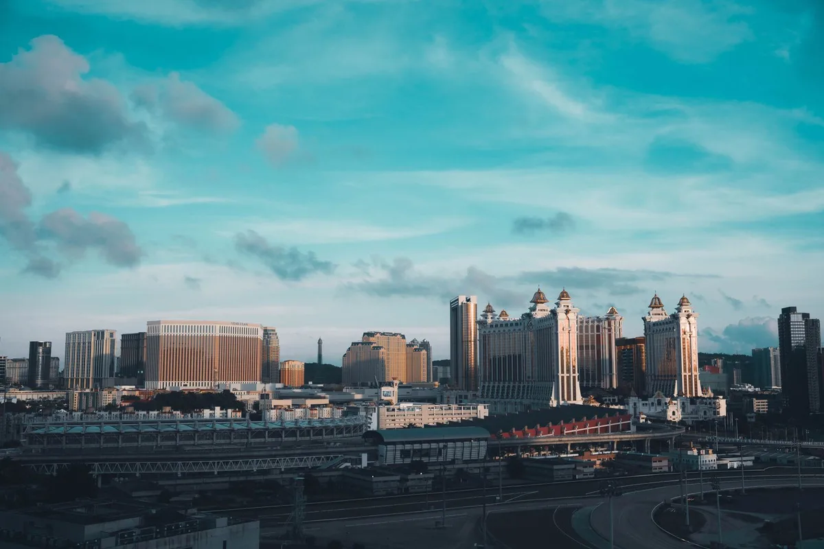 The Cotai Strip resorts by day, the Galaxy and Venetian towers under a wide sky