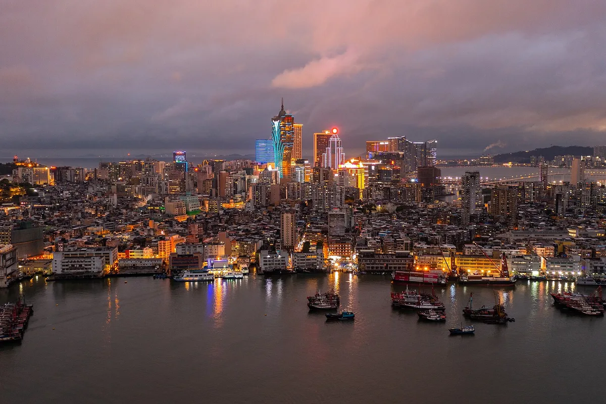 The Macau Peninsula skyline and the Grand Lisboa across the Inner Harbour at dusk