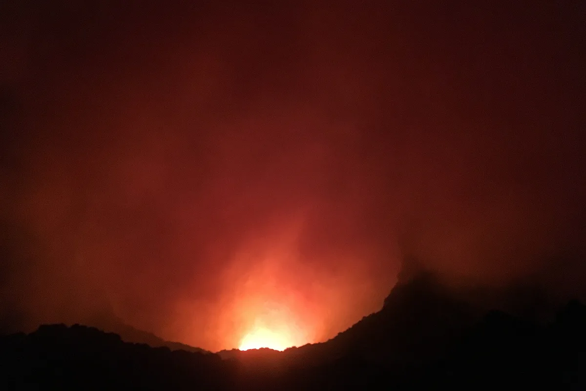 The glowing lava lake of Masaya Volcano's Santiago crater at night