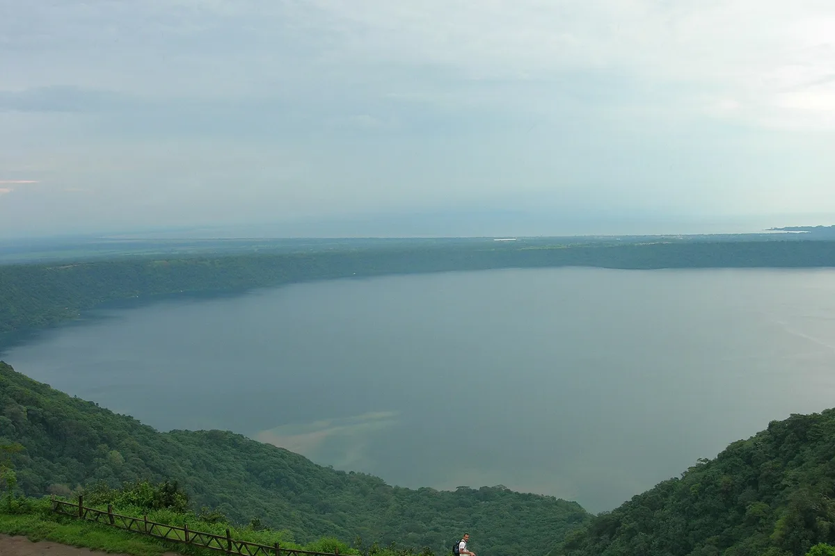 Apoyo Lagoon from the Catarina viewpoint, green crater walls around still water