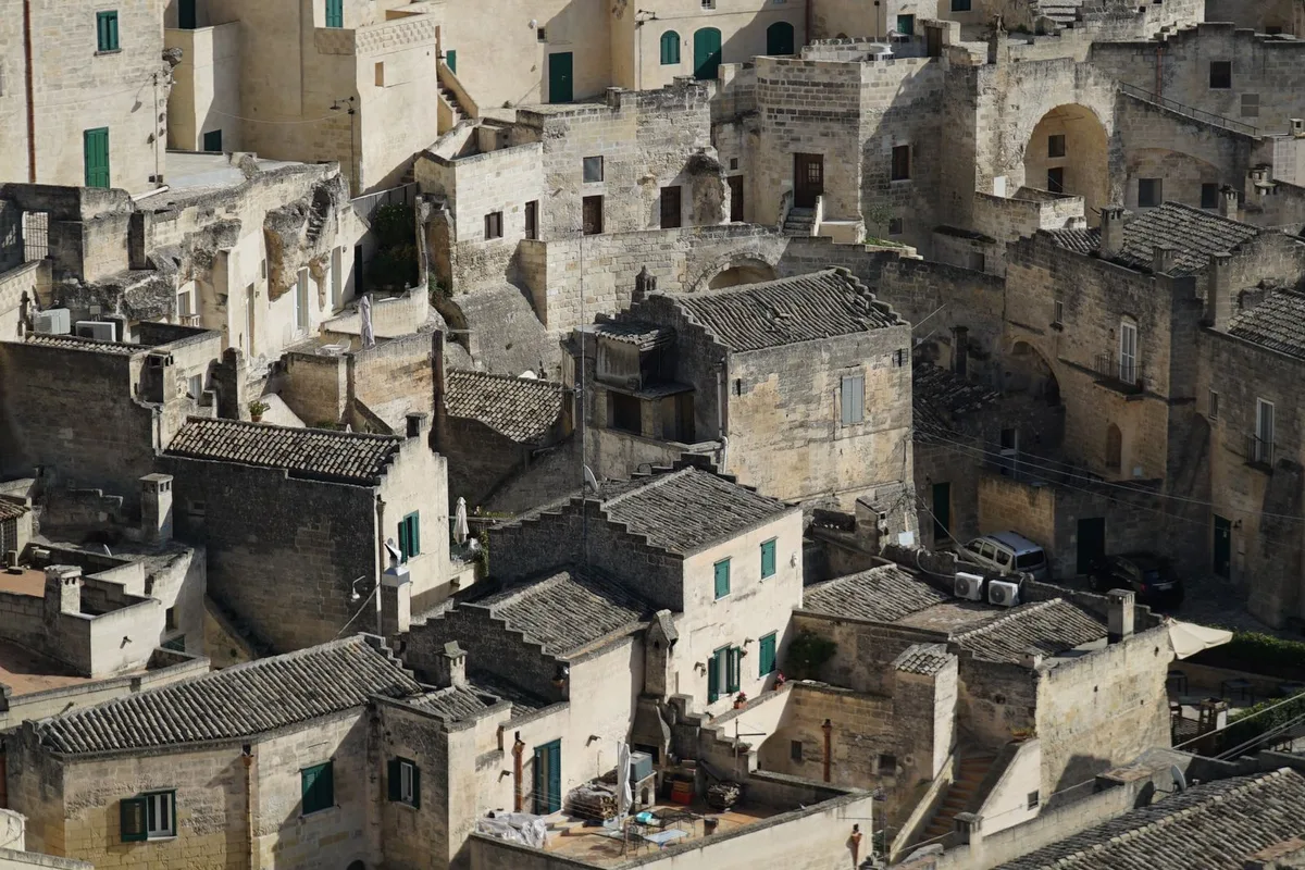 Cave houses stacked wall to wall in the dense lanes of the Sassi