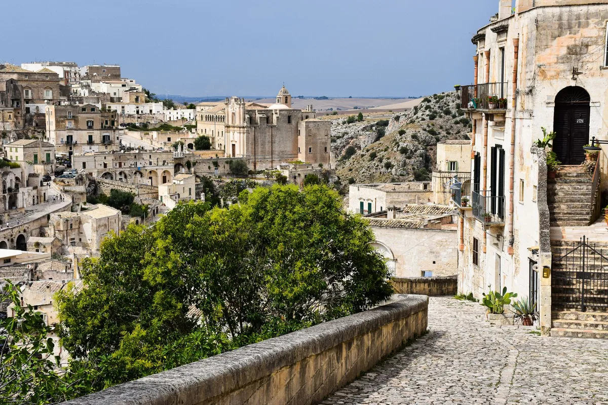 A paved panoramic lane above the Sassi, the Murgia plateau behind