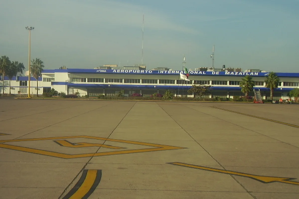 The terminal at Mazatlán International Airport seen from the apron, its name sign across the facade