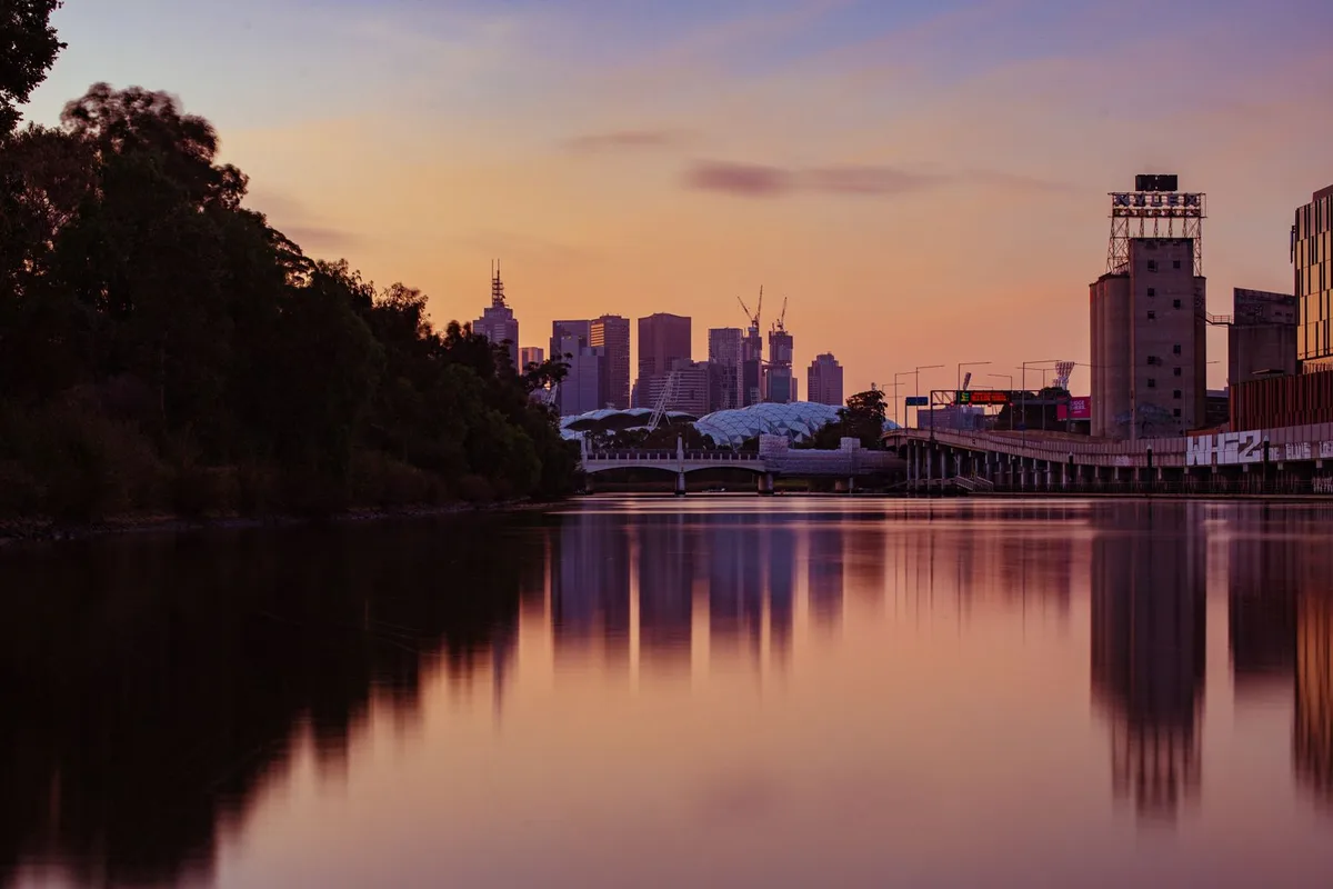 The Melbourne skyline at sunset across the Yarra River