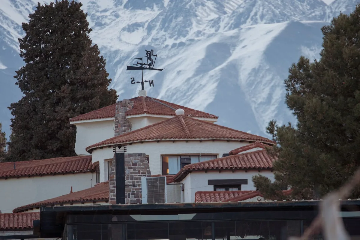 A winery lodge with a pool under the snow-capped Andes in Mendoza wine country